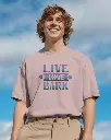 outdoor-front-view-t-shirt-mockup-smiling-male-model-in-boxy-white-tee-and-khakis-bright-sky-background-cheerful-casual-style-0997.webp