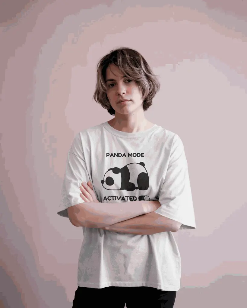 casual-fashion-tshirt-mockup-featuring-woman-in-loose-white-tee-and-neutral-pink-toned-background-01263.webp